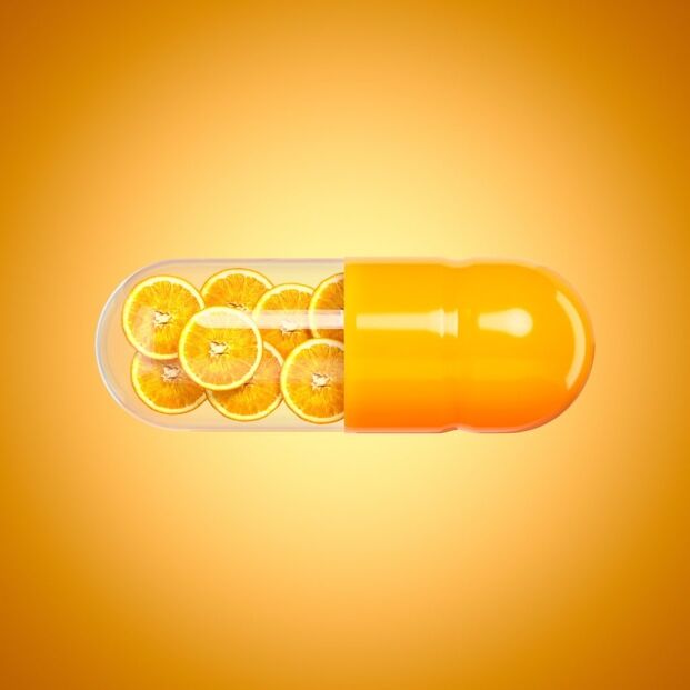 stylised vitamin C capsule containing orange slices